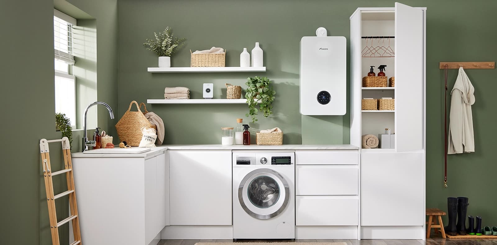 A white Worcester Bosch boiler fitted on the wall of a utility room